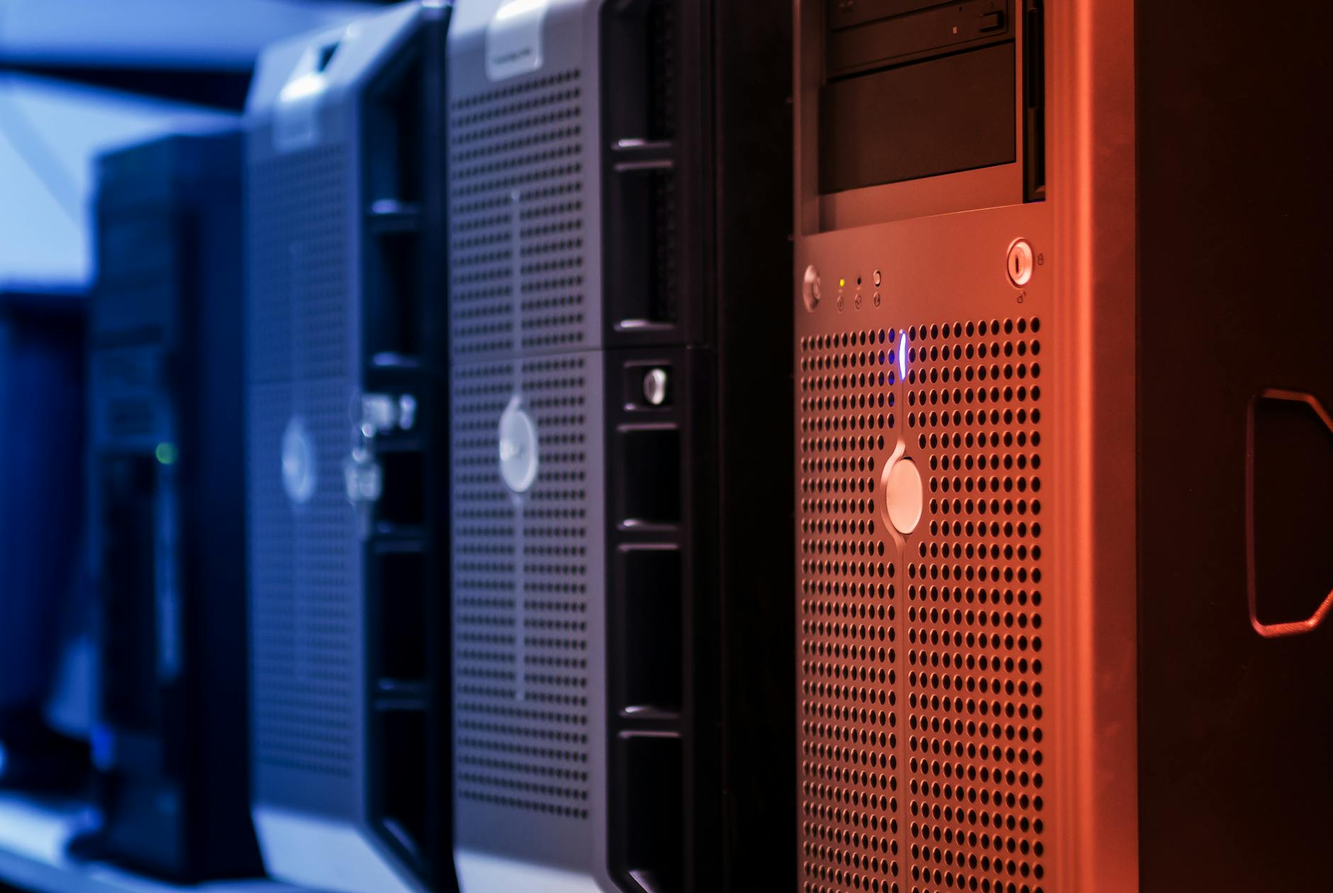 Rows of illuminated server racks in a modern data center, representing affordable European cloud hosting.