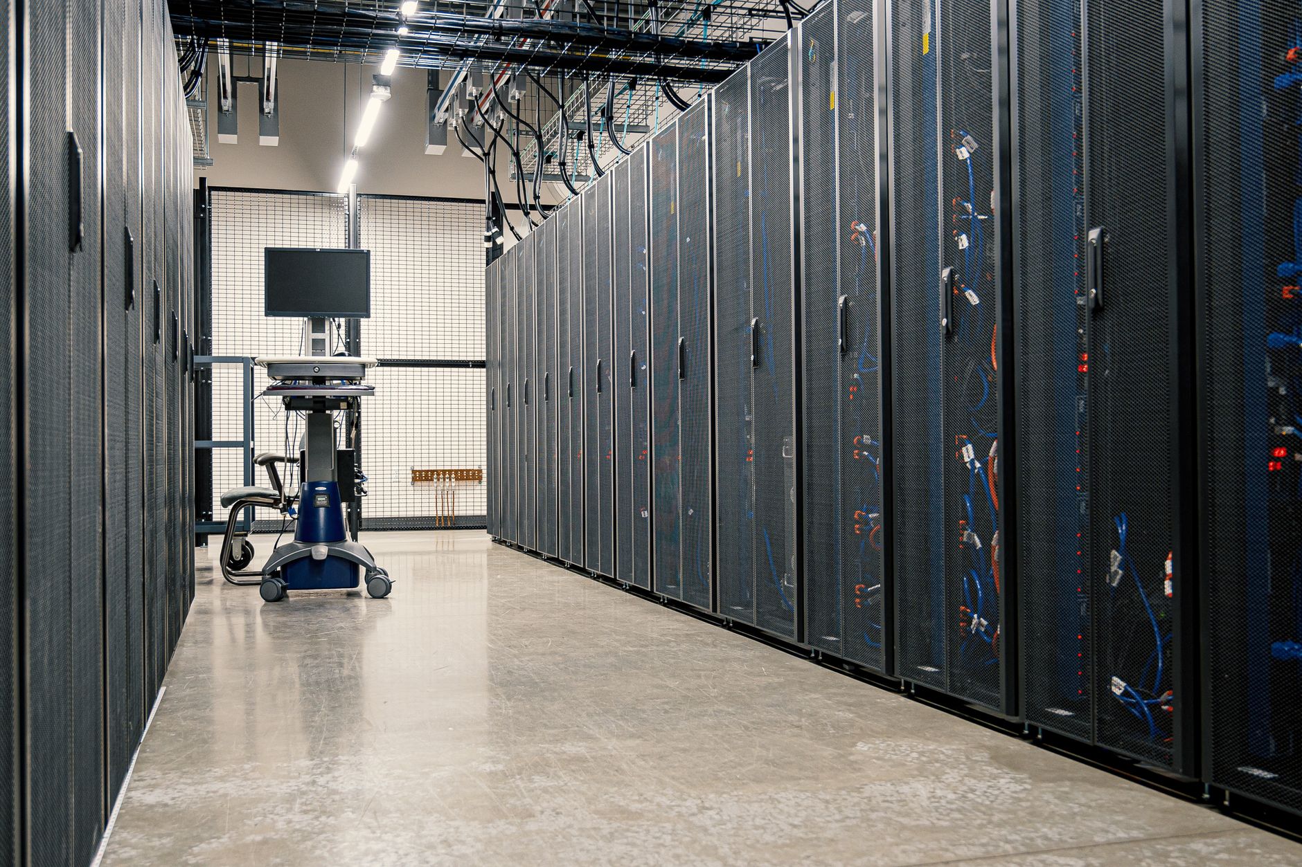 Rows of illuminated server racks in a modern data center, representing EU cloud infrastructure for developers.